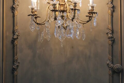 gold and white uplight chandelier