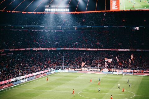 people watching football game on stadium