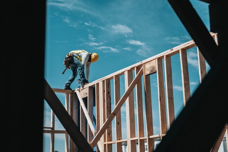construction worker in hard hat on building frame