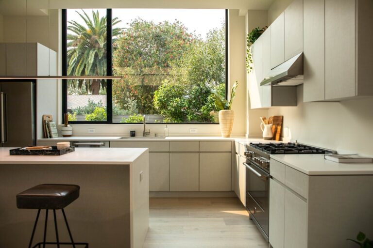 modern kitchen with island and large window