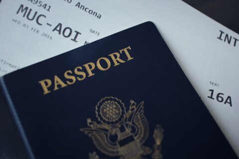 passport booklet on top of white paper