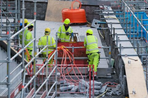 A group of construction workers working on a construction site
