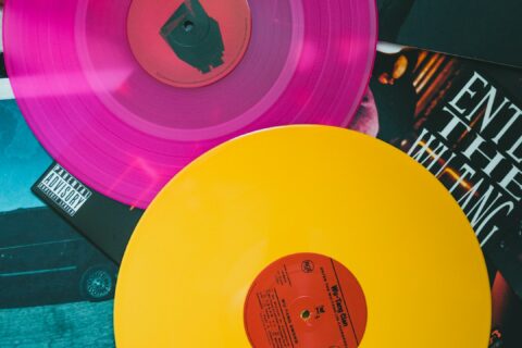 purple vinyl record on black and white table