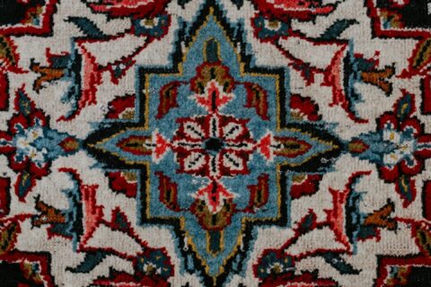 red white and black floral textile